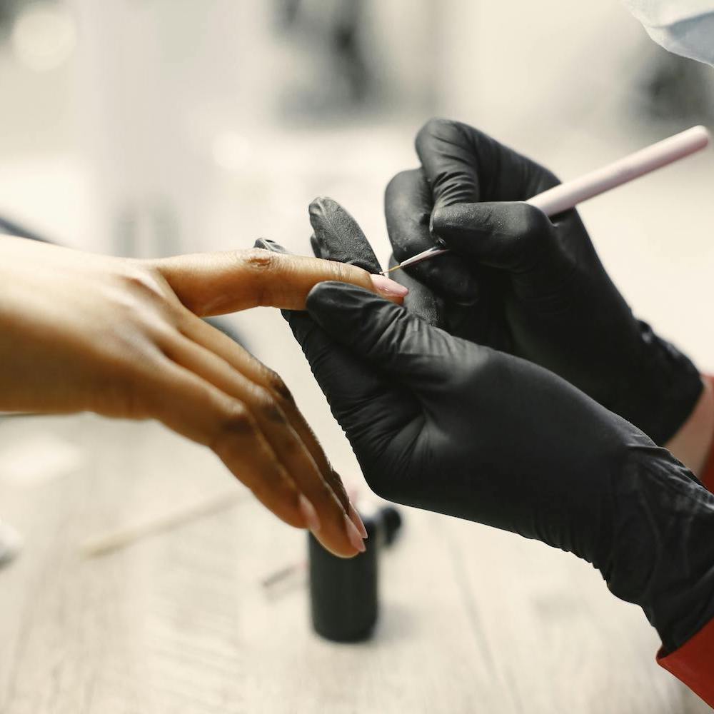 Precise nail shaping and cuticle care during a Manicure