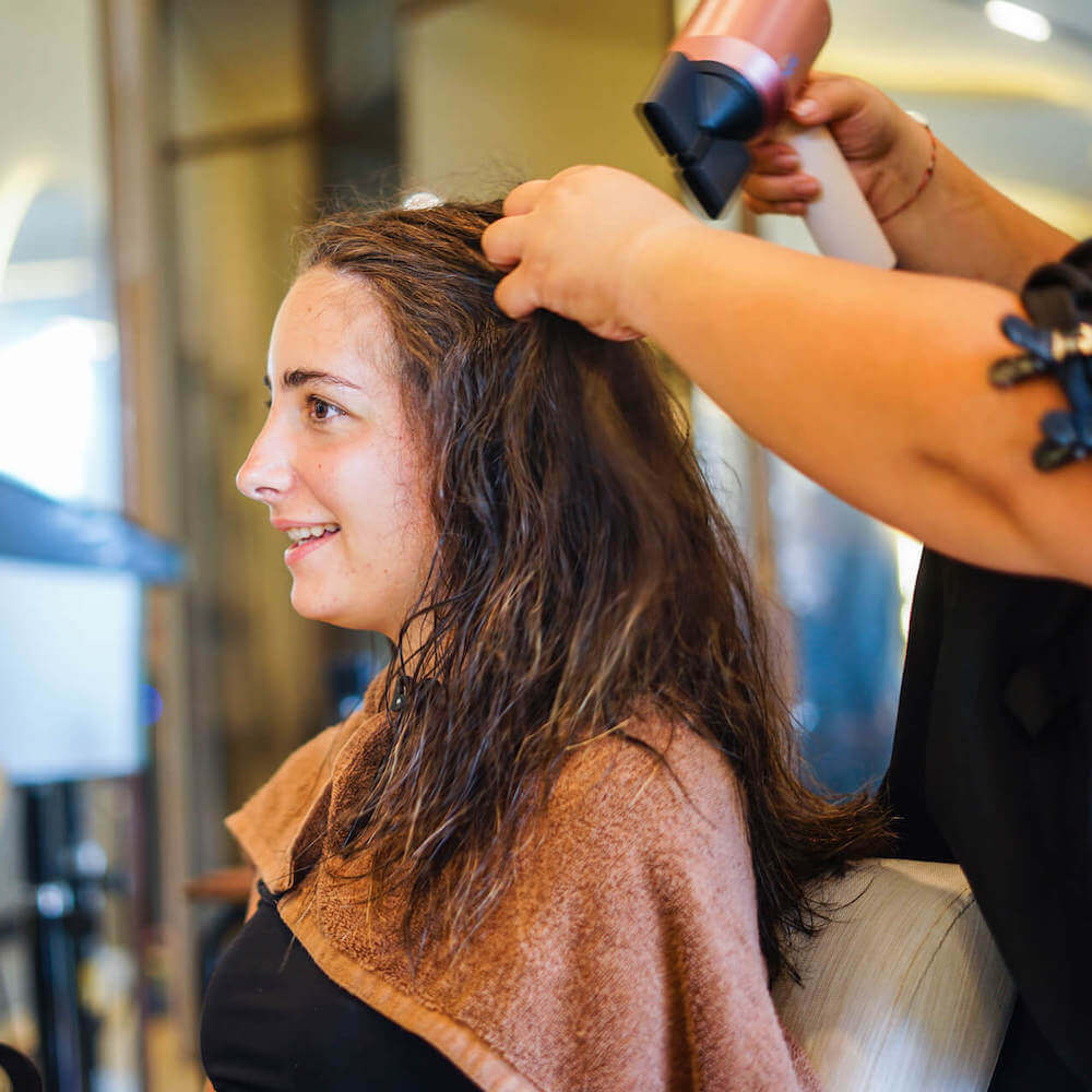 Professional Dyson blow dry Bali styling for smooth and glossy hair